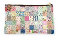 a multicolored patchwork purse with zipper