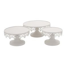 three white cake stands on top of each other