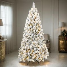 a white christmas tree in a living room