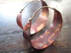 They have been a very popular pair! The color on the copper is due to the Flame-patina, which is a spontaneous process and allows for an array of red/orange colors patterns, no two are exactly alike. They are hammered and waxed. Very lightweight! Sterling ear wire fits into hole in back of hoop to close. 1 1/2" diameter. Copper Jewellery, Necklace Initial, Earrings Inspiration, Large Hoop Earrings, I Love Jewelry, Diy Schmuck, Sea Glass Jewelry, Copper Earrings, Copper Jewelry