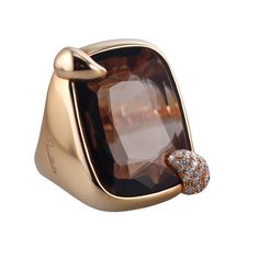 A pair of 18 karat rose gold ring set with smokey topaz and approximately 0.44ctw of G/VS diamonds. DESIGNER: Pomellato MATERIAL: 18k Rose Gold GEMSTONES: Smokey Topaz, Diamonds DIMENSIONS: Top is 30mm x 25mm. MARKED/TESTED: 750, Italian Marks, Pomellato. WEIGHT: 33.8 grams CONDITION: Previously Owned / Excellent Condition Luxury Topaz Ring With Diamond Accents, Luxury Gold Topaz Ring, Luxury Brown Formal Rings, Luxury Topaz Ring With Rose Cut Diamonds, Luxury Topaz Birthstone Ring, Elegant Brown Diamond Ring, Elegant Brown Diamond Ring For Formal Occasions, Elegant Brown Rings For Formal Occasions, Luxury Topaz Rings With Rose Cut Diamonds