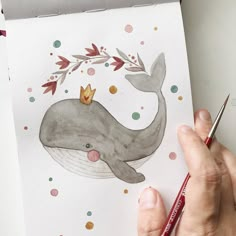 a drawing of a whale with a crown on its head