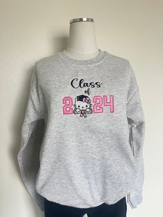 Class of 2024 senior gradation gift, Embroidered class of  2024 Sweatshirt, kitty sweater 8 oz., 50% Cotton/ 50% Polyester  Our sweatshirts run in unisex sizes, if between sizes or for a loose fit I recommend to size up. Make sure to choose your size accordingly! A size chart with measurements is listed, see photos. Washing Instructions: - Turn garment inside out - Hand wash or delicate was cycle - Wash in cold water - Use mild detergent - Do NOT use bleach - Air dry to avoid any shrinkage - Iro Casual Crew Neck Sweatshirt For Graduation, Kitty Sweater, Shoes Diy, Class Of 2024, School Life, Diy Shoes, Senior Year, Washing Instructions, Air Dry