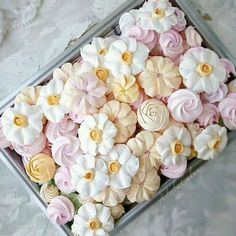 a box filled with lots of pink and white flowers