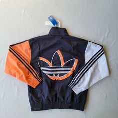 Size: . Please Select The Correct Size. Research The Size You Need Beforehand. Condition: New With Tags Style: Fm1537 Shipping: All Orders Are Shipped Within 1 Business Day. Saturdays And Sundays Are Not Business Days. Usps Does Not Process Mail On Sundays As Well. 100% Authentic. All Items Are Purchase From Verified Retail Stores Adidas Skateboarding Jacket, Vintage Blue Adidas Jacket, Blue Nylon Track Jacket For Fall, Adidas Urban Long Sleeve Windbreaker, Adidas Long Sleeve Windbreaker For Fall, Adidas Nylon Long Sleeve Windbreaker, Navy Adidas Track Jacket For Streetwear, Adidas Navy Track Jacket For Streetwear, Navy Windbreaker For Spring Streetwear