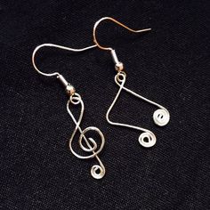 Treble Clef And An Eighth Note Earrings. They Are Made From Sterling Silver Wire And Sterling Silver Earrings Posts. #Style #Gemstone #Rock #Crystal #Trendy #Handmade #Gift #Her #Gems #Nature #Natural #Stone #Precious #Semiprecious #Statement #Metal #Chakra #Artisan #Chain #Indie #Forest #Intuition #Pride #Color #Luck #Love #Goth #Dainty #Witch #Magic #Beach #Glass #Sea #Fairy #Spring #Summer #Minimalist #Large #Boho #Winter #Fall Silly Earrings, Music Note Earrings, Music Earrings, Sea Fairy, Wire Earrings Handmade, Eighth Note, Apple Earrings, Patina Earrings, Boho Winter