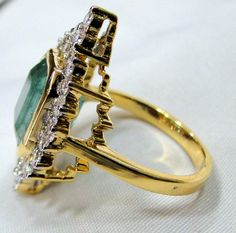 Emerald Ring, vintage 18K solid gold hallmarked Natural Emerald Diamond gemstone ring. Beautiful collection piece in very good condition. USA ring size -7.5 ( we can adjust size), size of top-30/17 mm, emerald weight-5.19 carat, diamond weight-1.18 carat VS G. Will supply with a certificate. Classic Gold Emerald Cluster Ring, Vintage Gold Emerald Ring For Wedding, Formal Gold Rings With Emerald, Vintage Gold Emerald Wedding Ring, Vintage Gold Emerald Ring With Diamonds, Vintage Emerald Ring With Hallmark, Vintage Gold Emerald Diamond Ring, Antique Emerald Diamond Ring For Formal Occasions, Art Deco Yellow Gold Emerald Ring For Anniversary