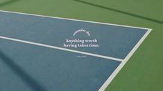 a tennis court with the words anything worth having takes time