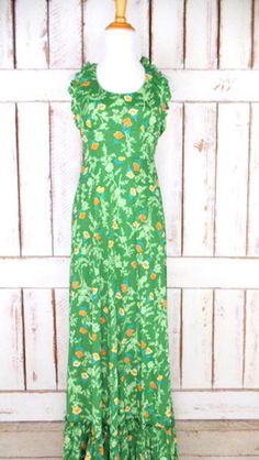 "70s vintage green floral maxi halter dress/long boho hippie ruffle festival dress/xsmall/small Measurements...taken flat -estimated fit: xsmall/small -marked size: vintage juniors 13 -across bust: 15\" -across waist: 13\" -length: 59\" Features... -awesome floral print throughout -beautiful ruffle detail hemline -pretty ruffle detail on halter top -back zipper -unlined -polyester/triacetate -Rage of California Condition... -excellent vintage condition -minimal wear DC1303*" Fitted Green Maxi Dress For Summer, Green Fitted Halter Neck Maxi Dress, Fitted Green Halter Neck Maxi Dress, Spring Green Maxi Dress For Garden Party, Green Maxi Dress For Spring Garden Party, Green Maxi Dress For Garden Party In Spring, Fitted Green Maxi Dress For Garden Party, Vintage Floral Print Maxi Dress For Summer, Vintage Ruffle Maxi Dress For Beach