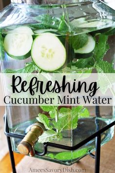 a glass container filled with cucumber mint water