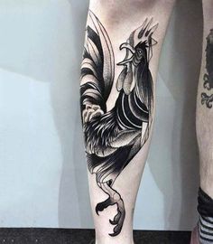 black and white rooster tattoo on the leg