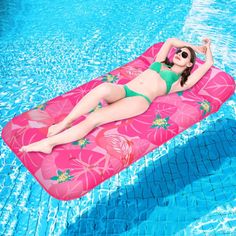 a woman laying on an inflatable pool float