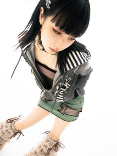 a young woman with black hair and boots