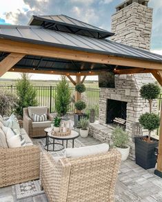 an outdoor living area with wicker furniture