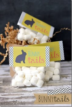 bunny tails candy bar wrappers are shown in front of some marshmallows