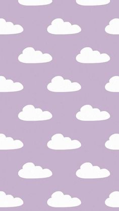 the sky is filled with white clouds against a purple background that matches the wallpaper