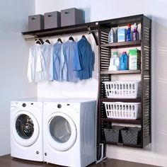 a washer and dryer sitting next to each other in front of a shelf