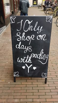 a chalkboard sign that says i only shop on days end with y