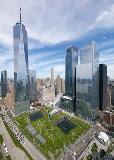 an aerial view of two skyscrapers and a park in the foreground, surrounded by other tall buildings