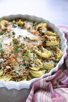 a casserole dish filled with pasta and cheese