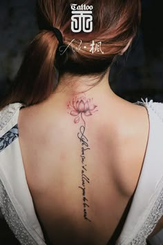 a woman with a tattoo on her back