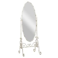 a white mirror sitting on top of a metal stand with an ornate design around it