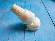 an ice cream cone sitting on top of a blue table