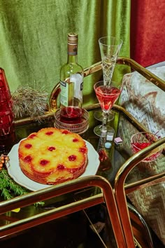 a pineapple pie on a table with wine glasses and other holiday decorations around it