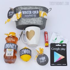 various items that include honey, lemons, and candy are arranged on a white surface