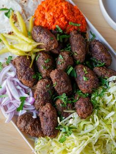 meatballs, cabbage and carrots on a plate