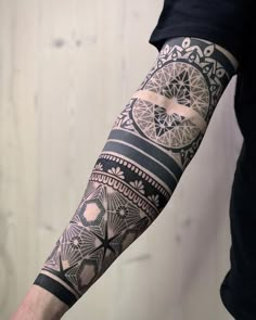 a man with a tattoo on his arm