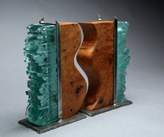 a sculpture made out of glass and wood