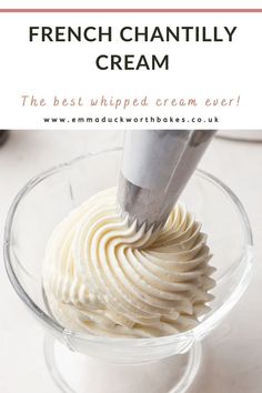 the best whipped cream ever in a glass bowl with a knife sticking out of it