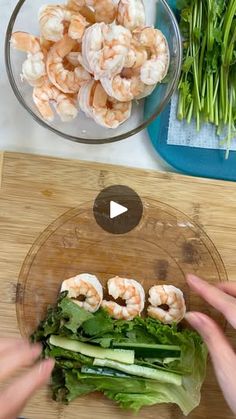 someone cutting up some food on top of a wooden board next to green onions and scallions