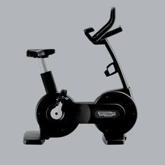 an exercise bike is shown with the handlebars on it's back end