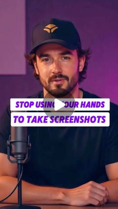 a man sitting in front of a microphone with the words stop using our hands to take screenshots