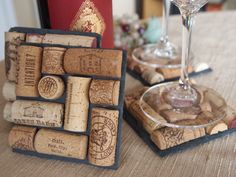 two wine cork coasters sitting on top of a table