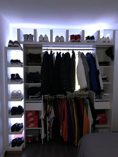 the closet is full of shoes and clothes