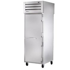 a stainless steel refrigerator sitting on wheels against a white background