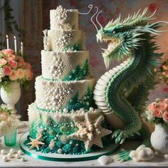 there is a large cake decorated with pearls and green dragon figurines on the table