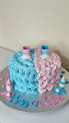 a blue and pink cake on top of a table