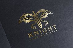 the knight company logo is shown on a black paper with gold foil lettering and a golden dragon