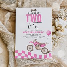 two fast birthday party card with pink dirt bike and balloons on it, surrounded by flowers