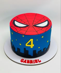 a spiderman cake with the number four on it