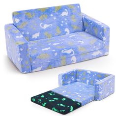 a blue couch and ottoman with an elephant pattern on the back, both in different colors