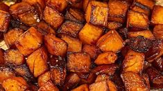 close up view of cooked sweet potatoes with brown sugar on top, sitting on a plate