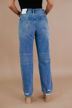 Step back into the '90s with the High Rise Baggy Denim Jeans from KANCAN, a perfect blend of vintage vibes and modern comfort. These jeans capture the essence of retro cool with their high rise and relaxed, baggy fit. 12" Rise / 32" Inseam (in size 5/26) Hidden 5-button closure 100% Cotton Stretchiness Level >> Rigid We recommend sizing up one size in this style denim 90s Denim High rise Baggy denim Model Specs: Emily is wearing a size 5 in the photo.How will this item fit you? Check out our MODEL SPECS (Typical Sizing - Karli: S-Size 5/26 - 5ft 2in, Emily: S-Size 3/25 - 5ft 5in, Syd: L/XL- Size 15/ - 5ft 8in)﻿Need help with sizing? No problem! Join our VIP group on Facebook, Everyday Chic Boutique VIP Insiders to chat directly with our team and other customers just like you.Packaged with Dark Wash Mom Fit Jeans For Spring, Spring Dark Wash Mom Fit Jeans, Everyday Distressed Denim Blue Flare Jeans, Trendy Medium Wash Rigid Denim Flare Jeans, Trendy Medium Wash Cropped Denim Jeans, Everyday Distressed Denim Flare Jeans, High Rise Washed Blue Distressed Cropped Jeans, High Rise Distressed Washed Blue Cropped Jeans, Distressed High Rise Cropped Jeans In Washed Blue