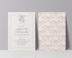 two cards with bows on them sitting next to each other