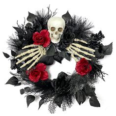 a wreath decorated with black and red roses, fake skeleton hands and bones on it