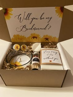 a box filled with candles and cards on top of a table